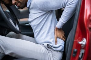 lower back injury in car