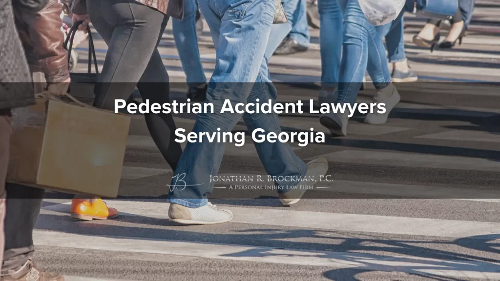 Pedestrians from the waist down crossing a street, with these words over the image: pedestrian accident lawyers serving georgia.